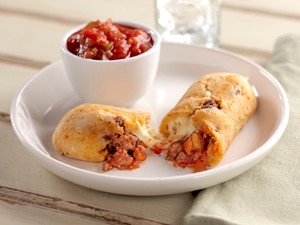 Gluten-Free Taco-Stuffed Bread Sticks Split open with a Cup of Salsa on the Side