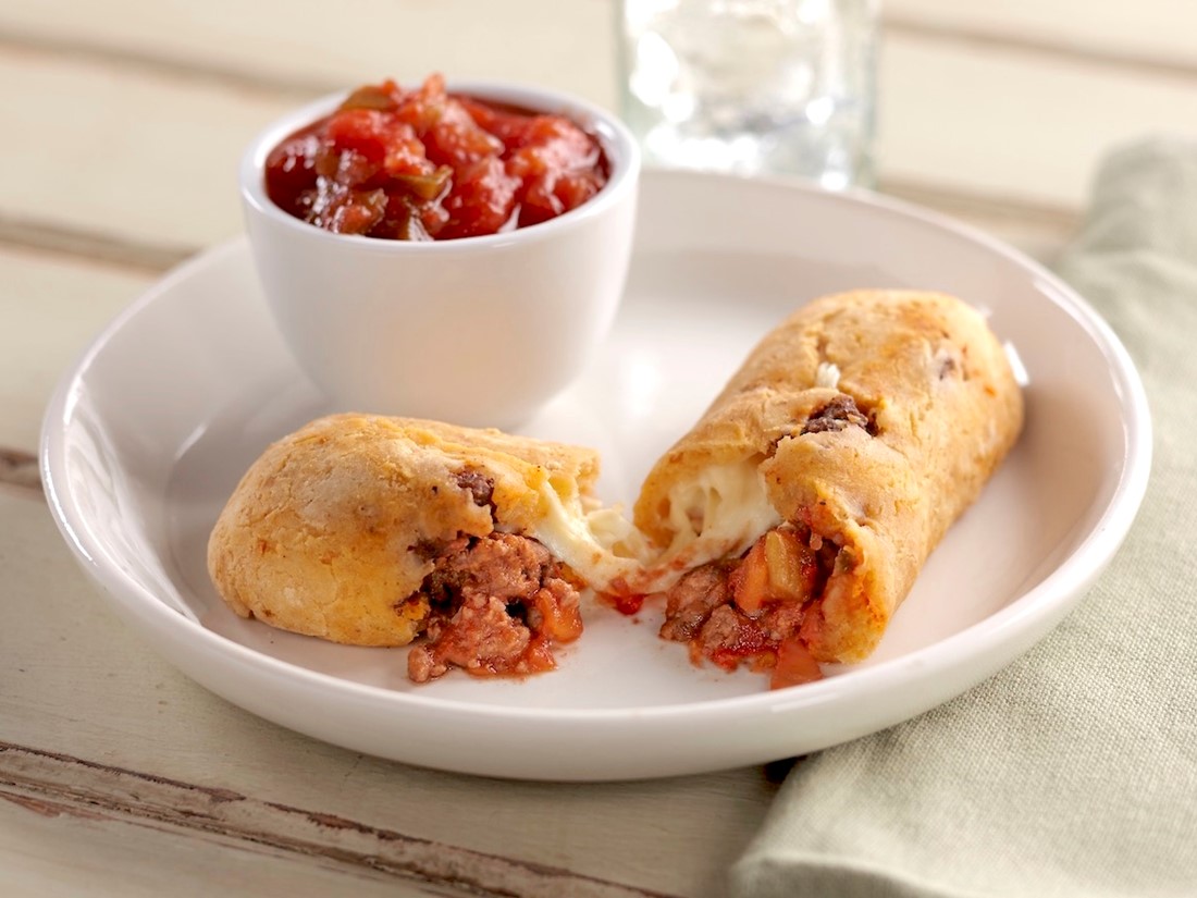 Gluten-Free Taco-Stuffed Bread Sticks Split open with a Cup of Salsa on the Side