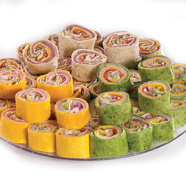 Assorted deli roll-ups wrapped in colorful flour tortillas