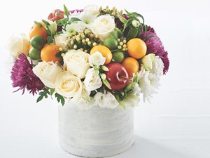 Flowers in Pot with Whole Limes, Whole Oranges, and Whole Red Apples