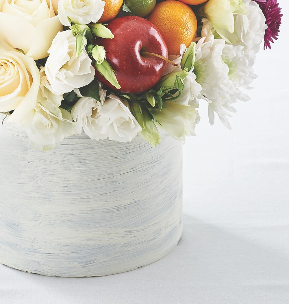 Flowers in Pot with Whole Limes, Whole Oranges, and Whole Red Apples