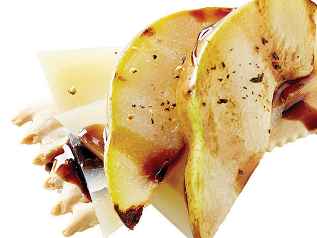 Crackers, Cheese Slices, Pear Wedges, and Balsamic Vinegar