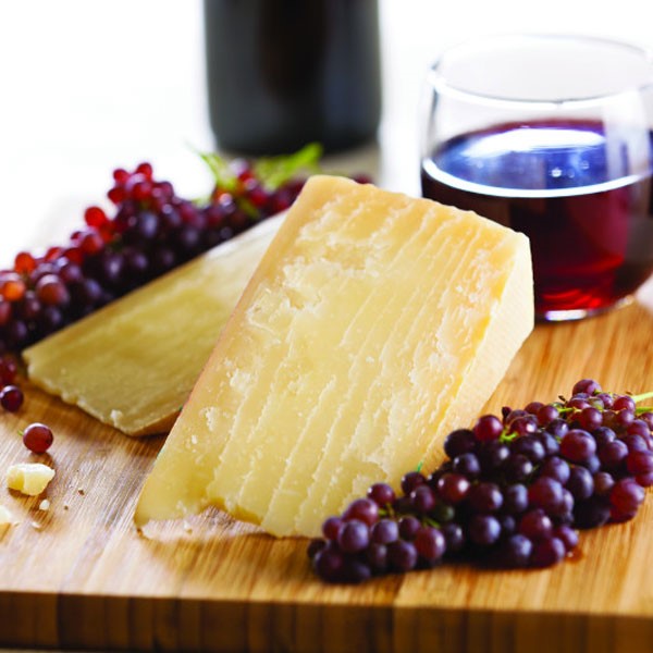 Cheese Board with Red Wine in Glass and Grapes